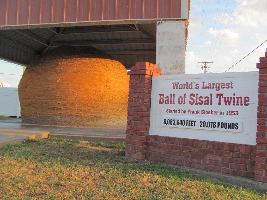 The world's largest ball of sisal twine sits proudly under a protective canopy in Cawker City, KS.