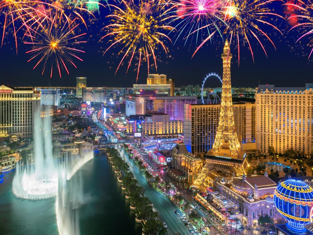 Fireworks at night over the bright lights of the Las Vegas Strip