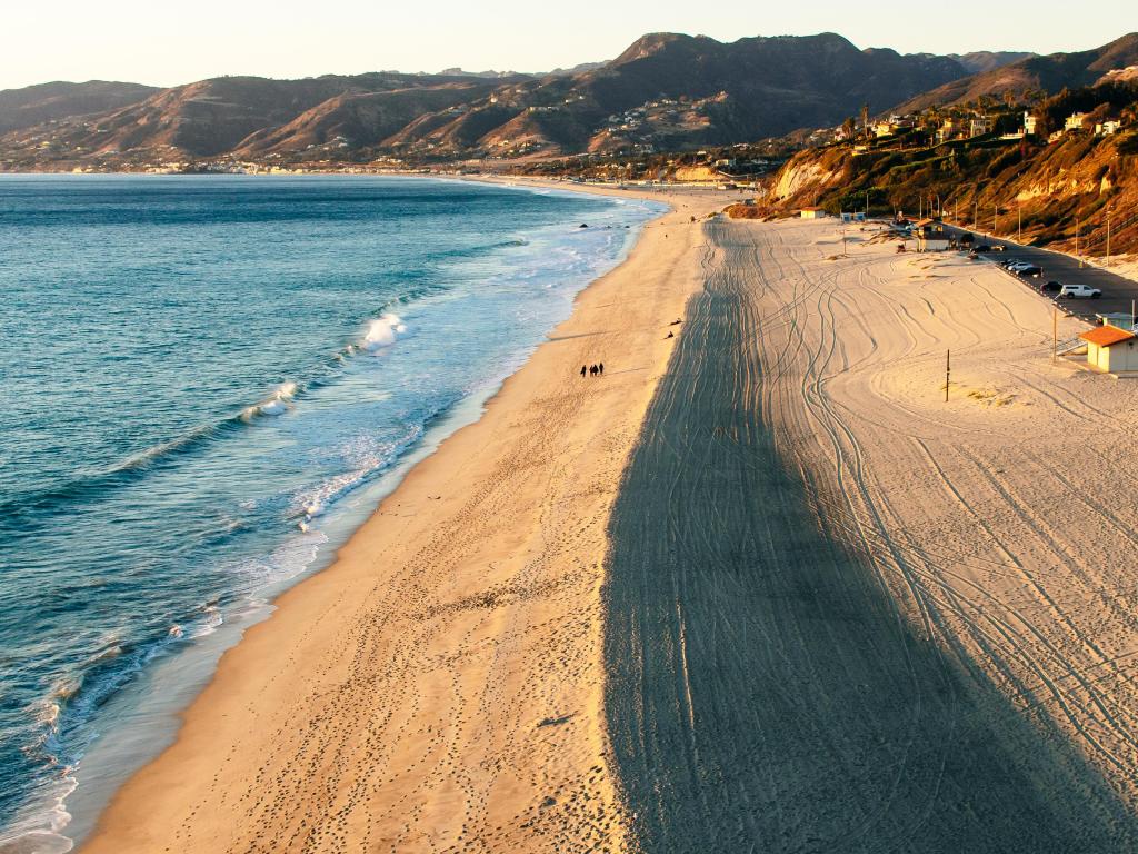 Aerial photo of the empty sandy beach on a sunny day