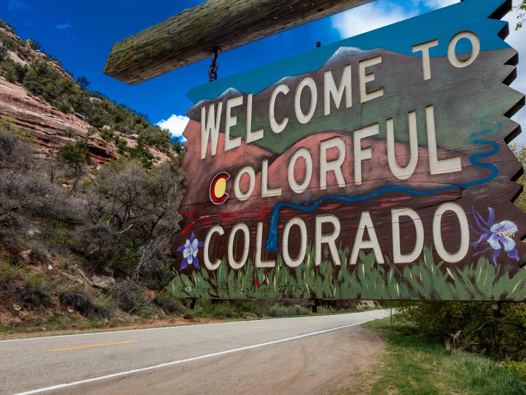 Welcome to Colorful Colorado State Road Sign near Utah Colorado border going towards Norwood Colorado
