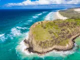 Fraser Island, Queensland, Australia with a view of the famous Indian Head part of the island surrounded by sea on a sunny day.