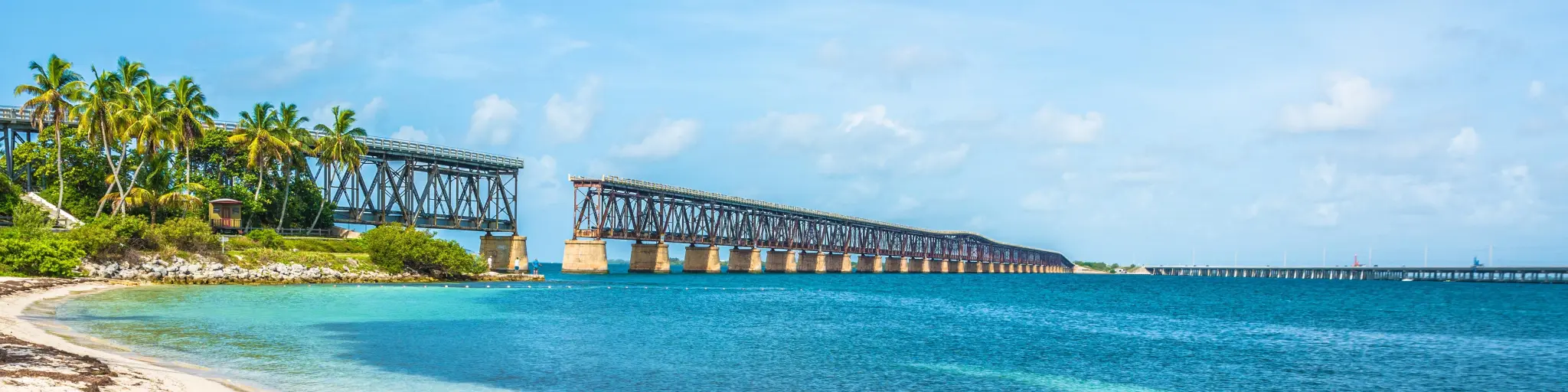 The view from the beach on a sunny day, on the broken railroad bridge in Key West