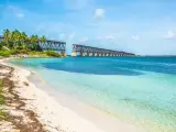 The view from the beach on a sunny day, on the broken railroad bridge in Key West