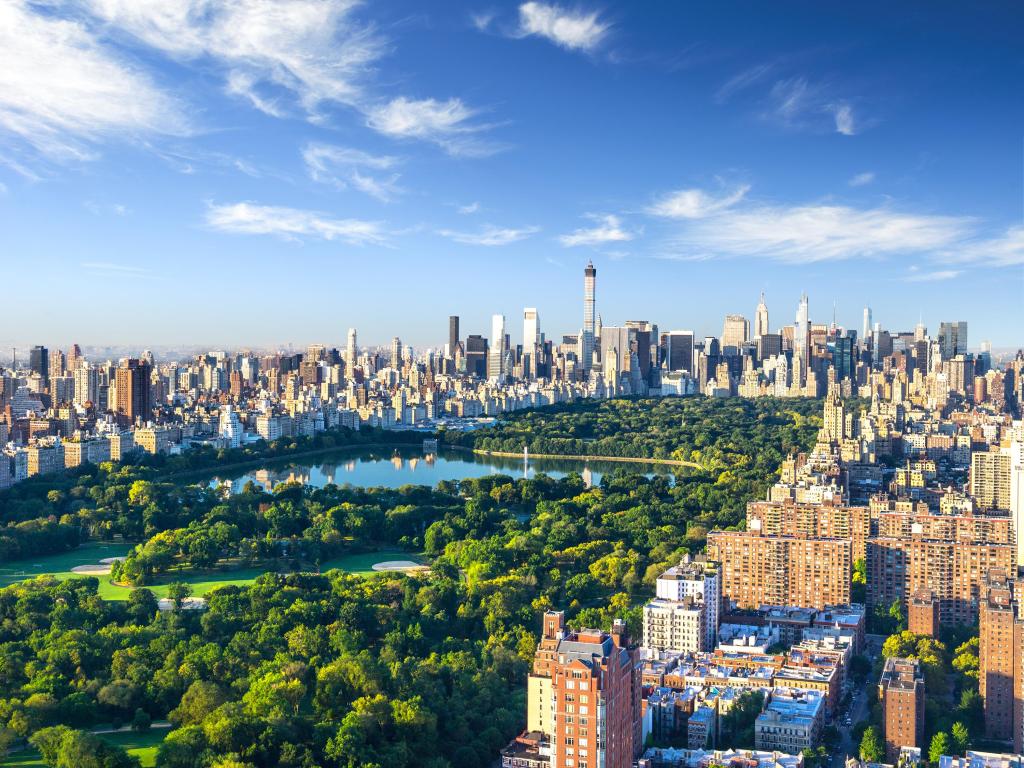 Aerial view of Central Park surrounded by the concrete buildings of Manhattan, New York 