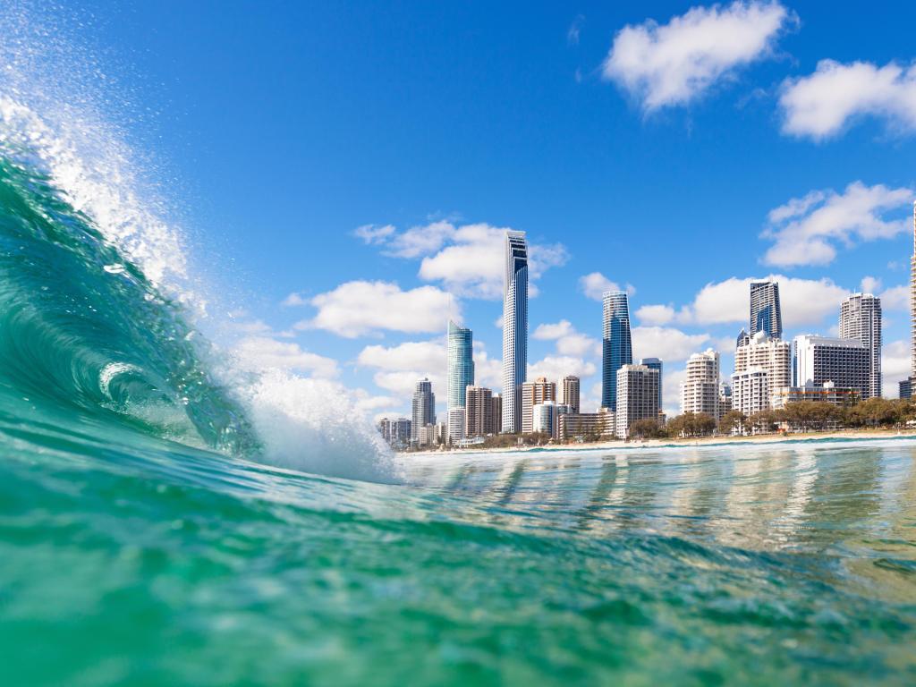 High rise buildings viewed from a building wave in turquoise sea