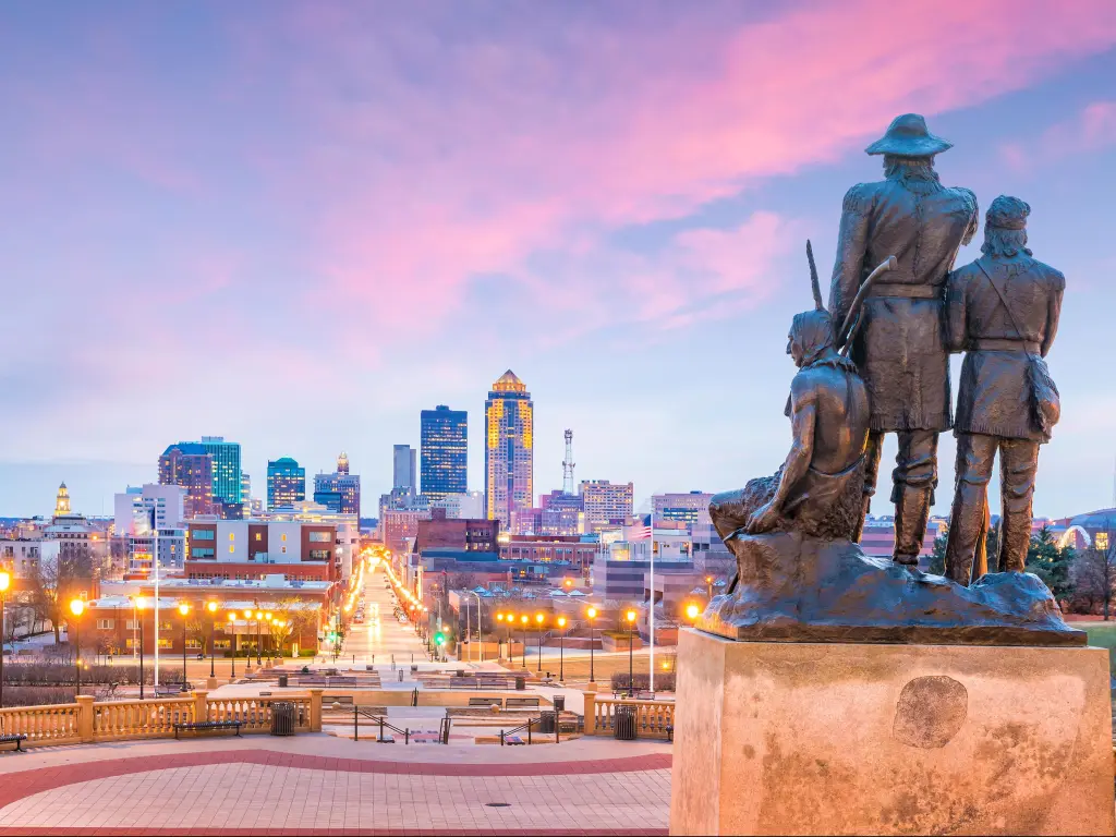 Des Moines Iowa skyline in USA with The Pioneer of the former territory statue