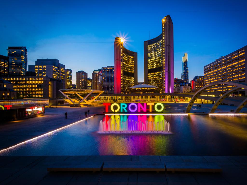View of Nathan Phillips Square and Toronto Sign in downtown at night, in Toronto