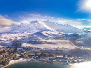 Winter in Lake Chelan, WA with snow capped mountains in the background