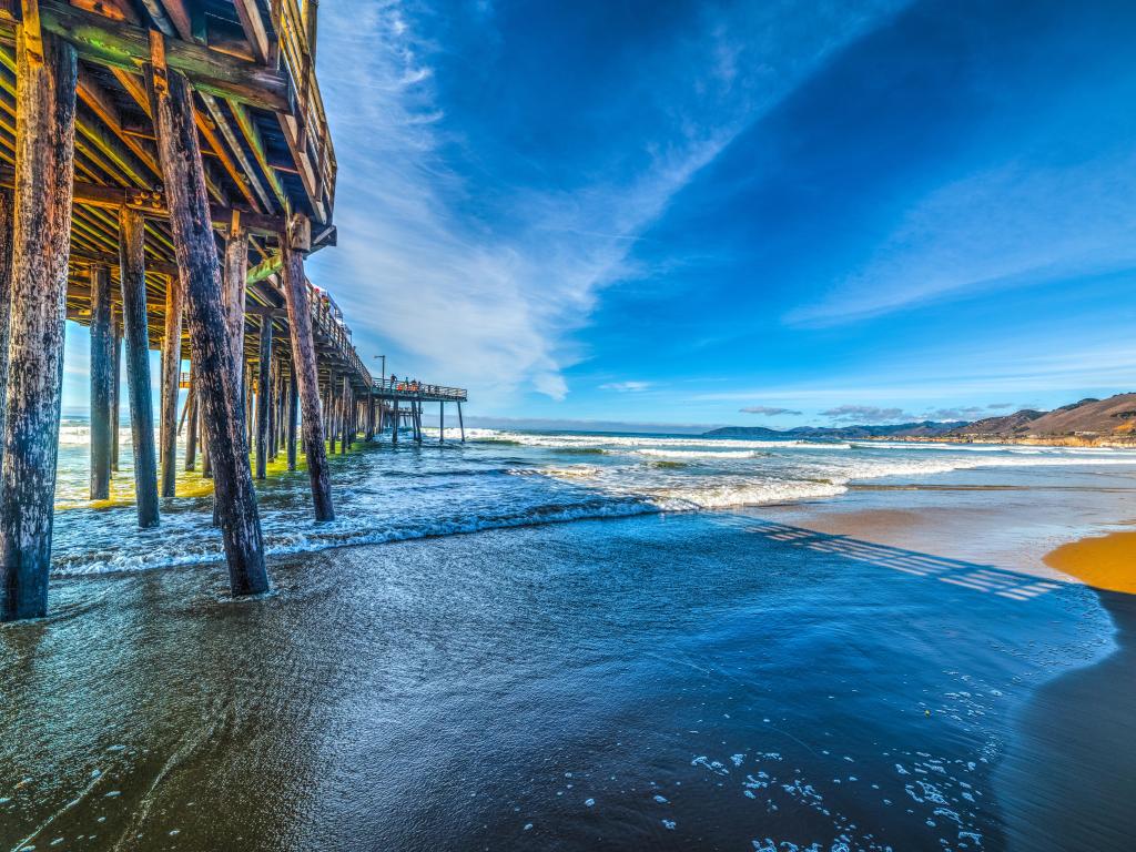 Pismo Beach, California, USA taken at the wooden pier in Pismo beach seen from the foreshore and taken on a sunny day.
