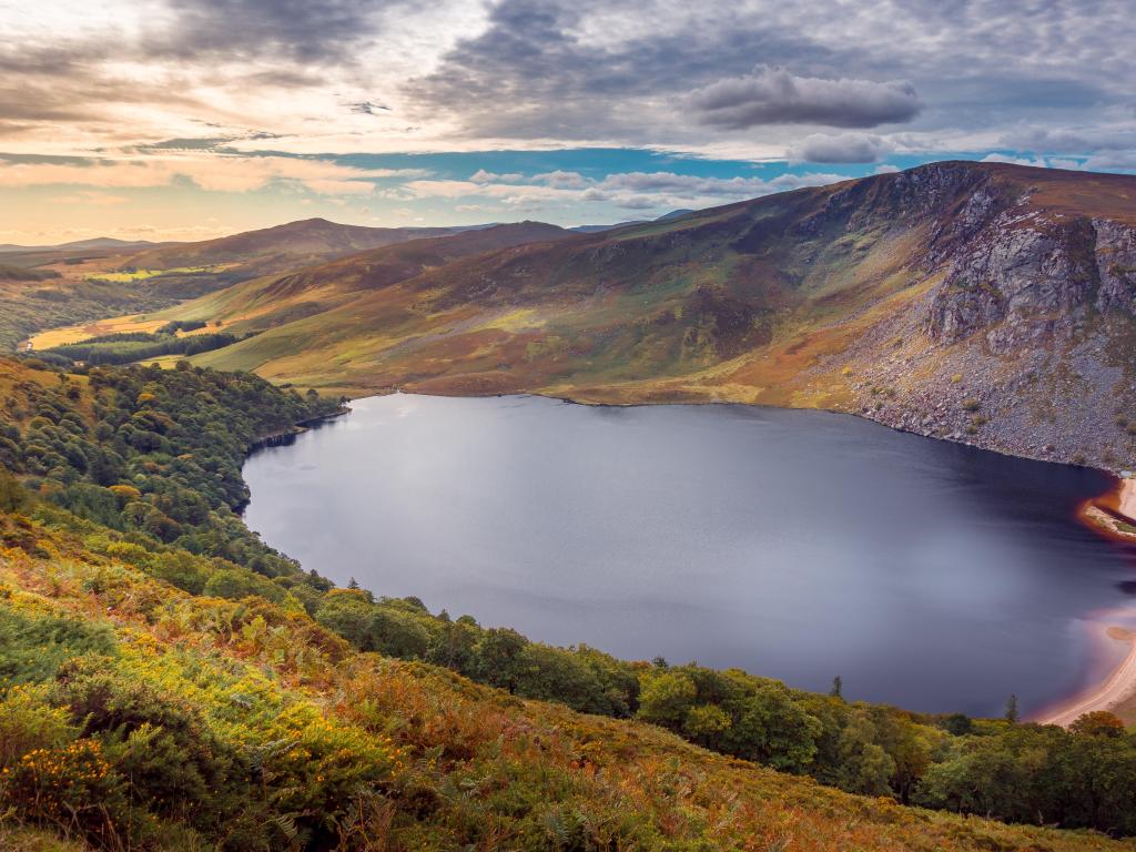 Amazing stunning Irish landscape with green hills and meadows and so-called Guinness Lake in Wicklow mountains near Dublin, Ireland