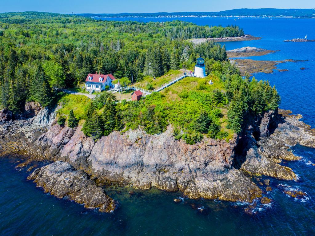Rockland, Maine, USA with an aerial view of Owls Head Light located at the entrance of Rockland Harbor on western Penobscot Bay in the town of Owls Head, Knox County, Maine.