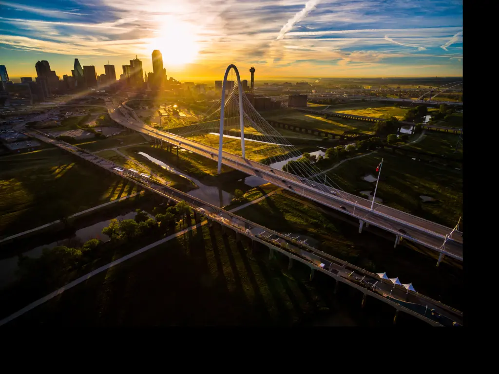 Margaret Hunt Hill Bridge with amazing views of downtown Dallas at sunset