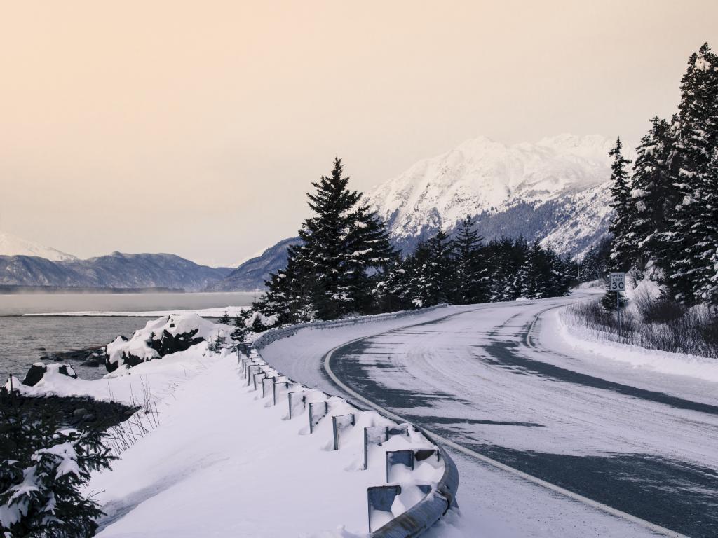 A road with a dusting of snow in the winter near Haines, Alaska