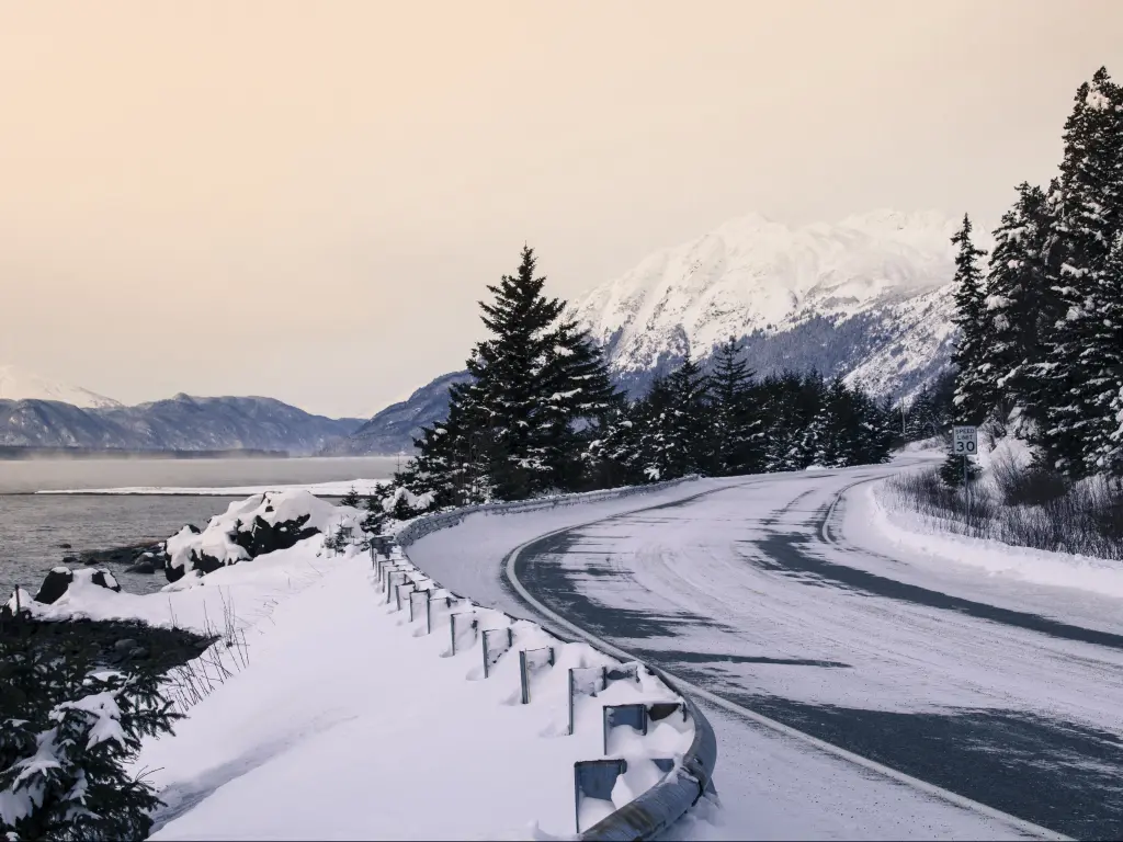 A road with a dusting of snow in the winter near Haines, Alaska