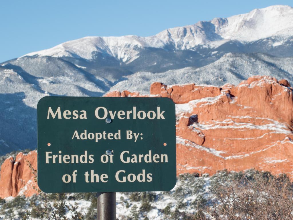 A scenic overview in the Garden of the Gods, with a sign that says 