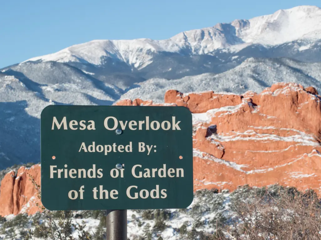 A scenic overview in the Garden of the Gods, with a sign that says "Adopted by: Friends of the Garden of the Gods"