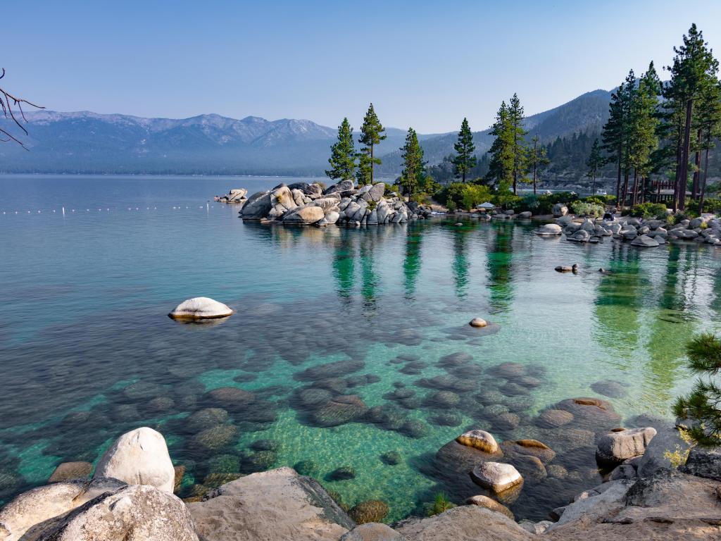 Lake Tahoe, USA taken on a clear, summer day in Lake Tahoe with views of the clear water and surrounding mountains and forest. Taken near Incline Village, Nevada and Sand Harbor Beach.