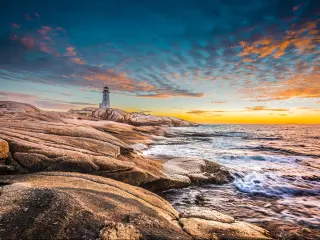 Halifax, Nova Scotia, Canada taken at Peggy's cove lighthouse at sunset with an ocean view. 