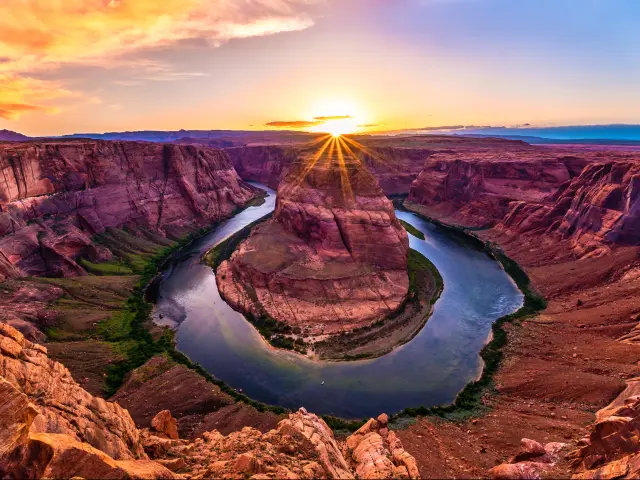 Horseshoe Bend, Arizona, USA at sunset with the river around the cliff rock.