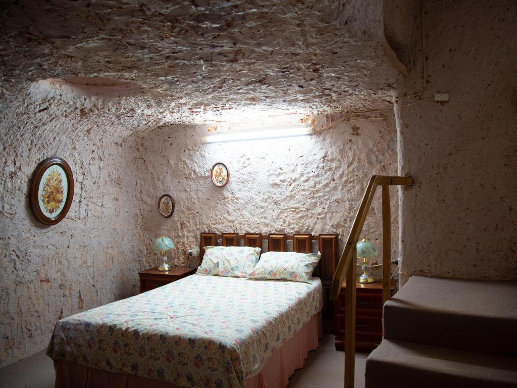 A bed in a man-made underground cave in Coober Pedy