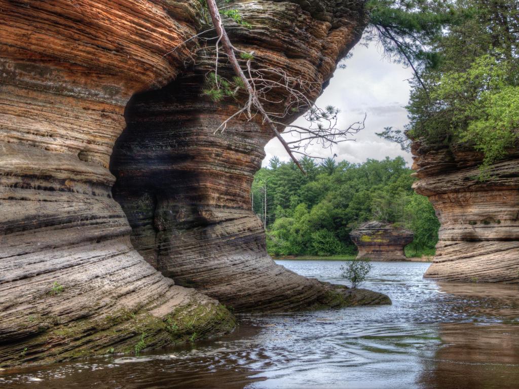 Witches Gulch, Wisconsin Dells, USA with impressive cliff edges and trees in the distance, river in the foreground. 