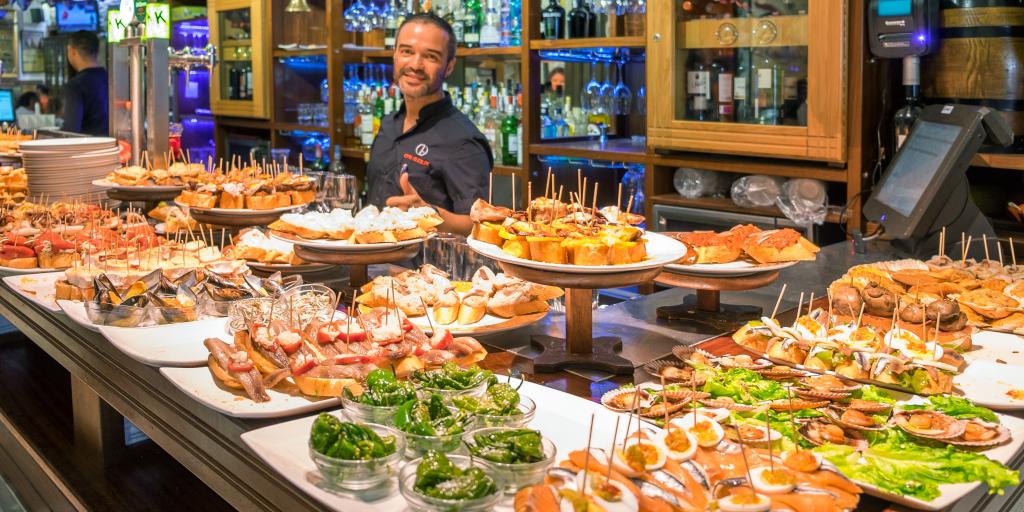 Pintxos being served in San Sebastian bar - Basque country in Spain