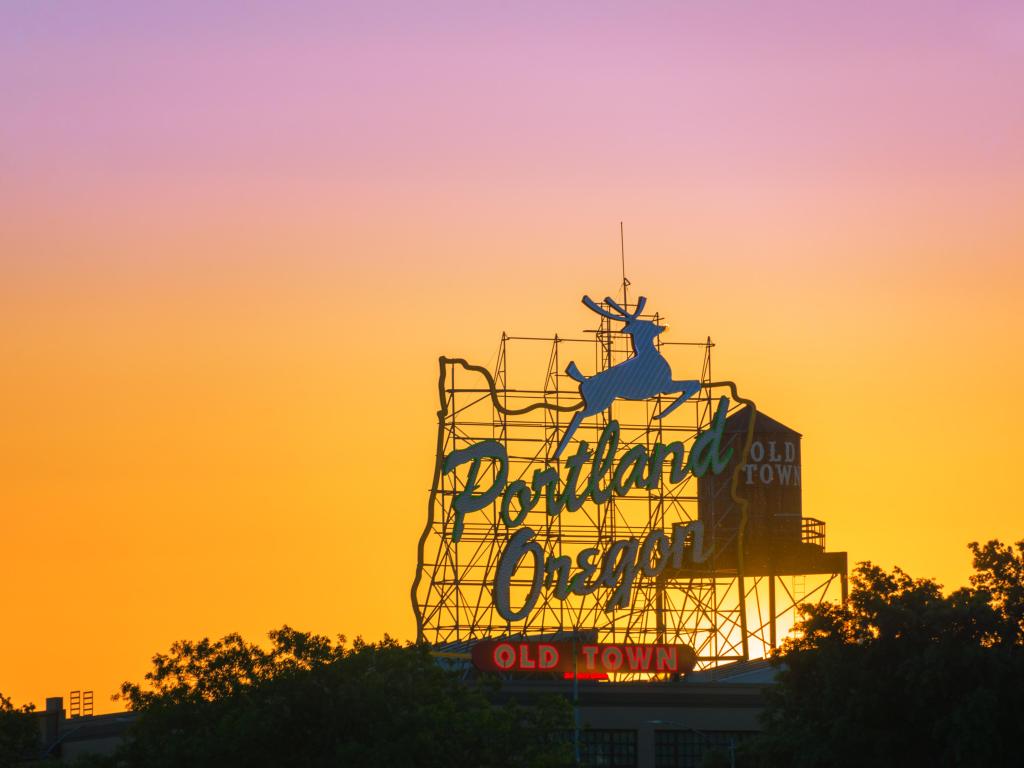 Sunset over the iconic Portland, Oregon, sign in downtown Portland
