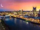 Nashville, Tennessee, USA skyline with moon at sunset.