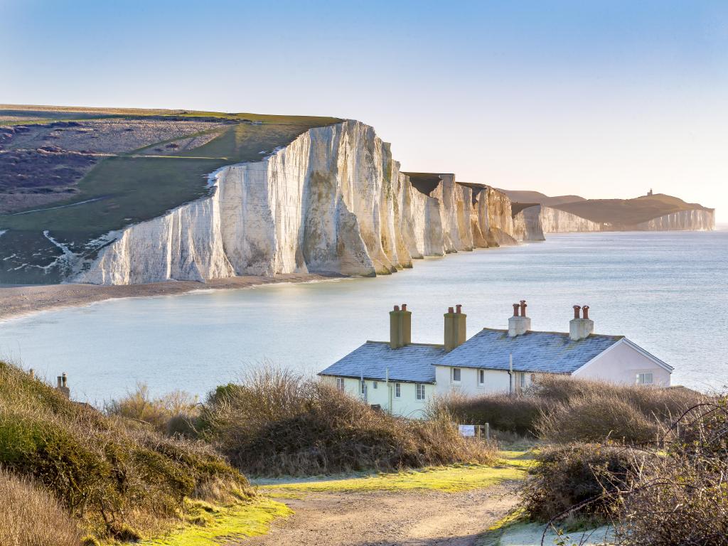 The Coast Guard Cottages & Seven Sisters Chalk Cliffs just outside Eastbourne, Sussex, England, UK.