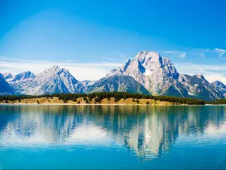 Grand Teton National Park, Wyoming. Reflection of mountains on Jackson Lake near Yellowstone.