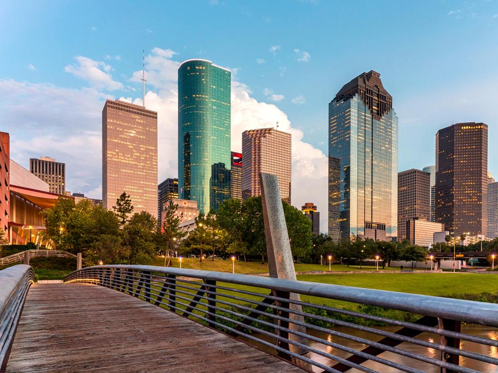 Buffalo Bayou Park, Houston, USA taken at the pedestrian bridge crossing over Houston's Buffalo Bayou with a beautiful view of downtown Houston skyline in the background.