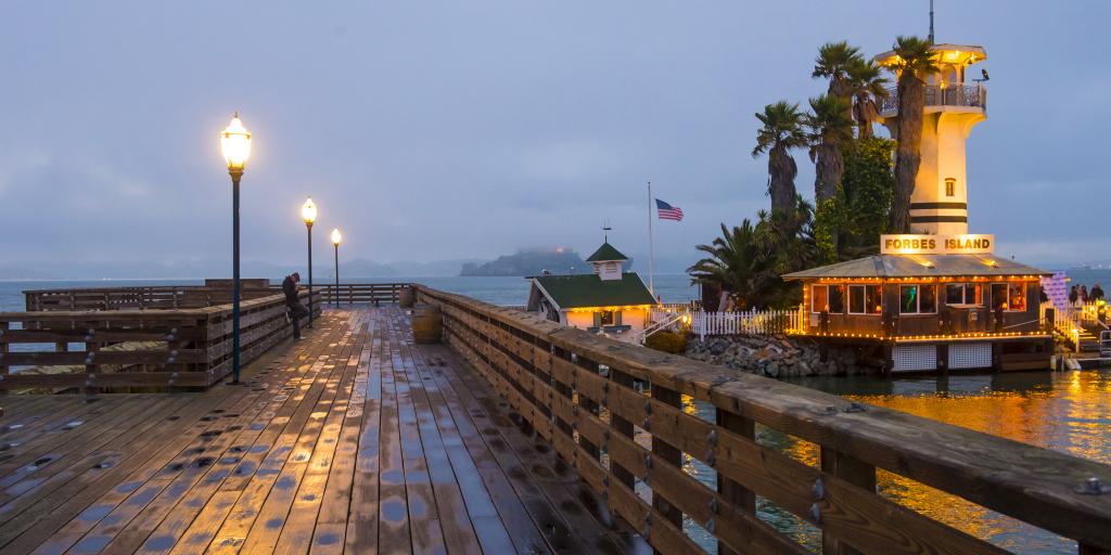 Pier 41 (next to Pier 39) sticking out into a misty San Francisco Bay with Alcatraz Island in the background.
