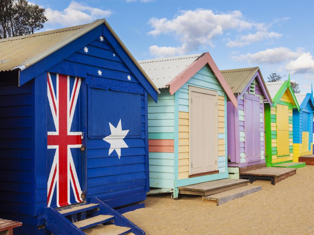 Brighton Beach, Melbourne, Australia Bathing boxes in a beach against blue sky.