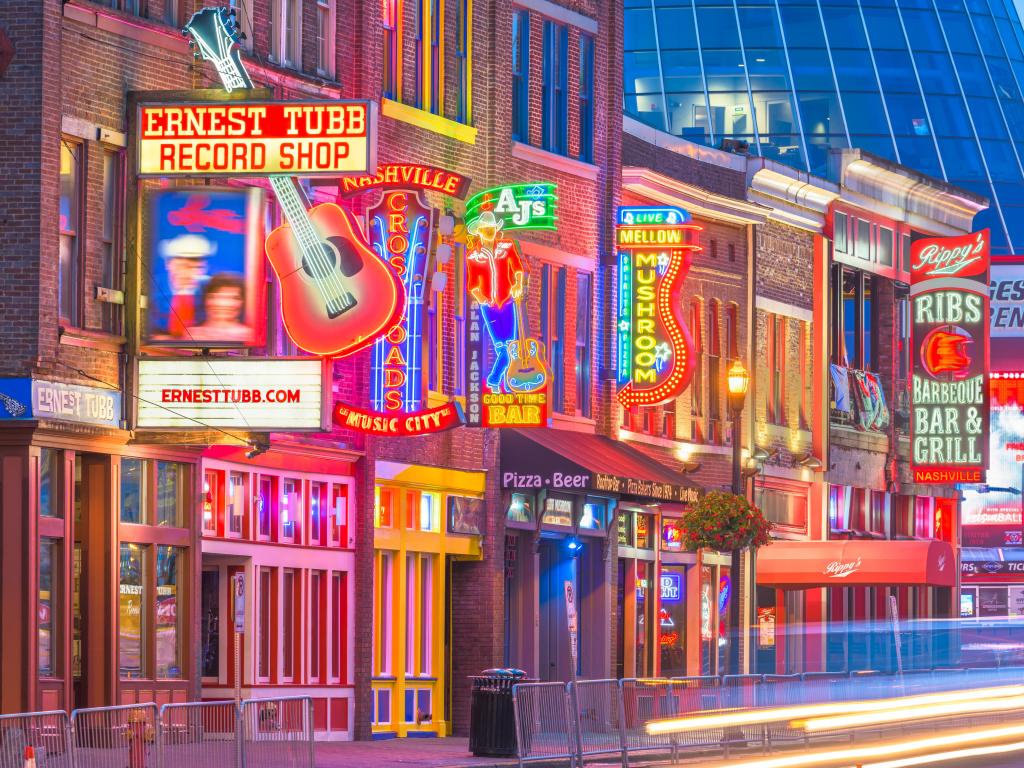 Honky-tonks on Lower Broadway with illuminations and bright signs advertising country music entertainment, Nashville, USA