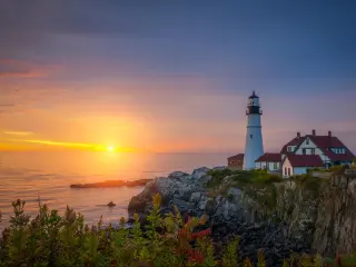 Portland, Maine, USA with a view of the Portland Head Light Sunrise in Maine.