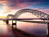 Hernando de Soto Bridge connecting Memphis, Tennessee with West Memphis, Arkansas at sunset.