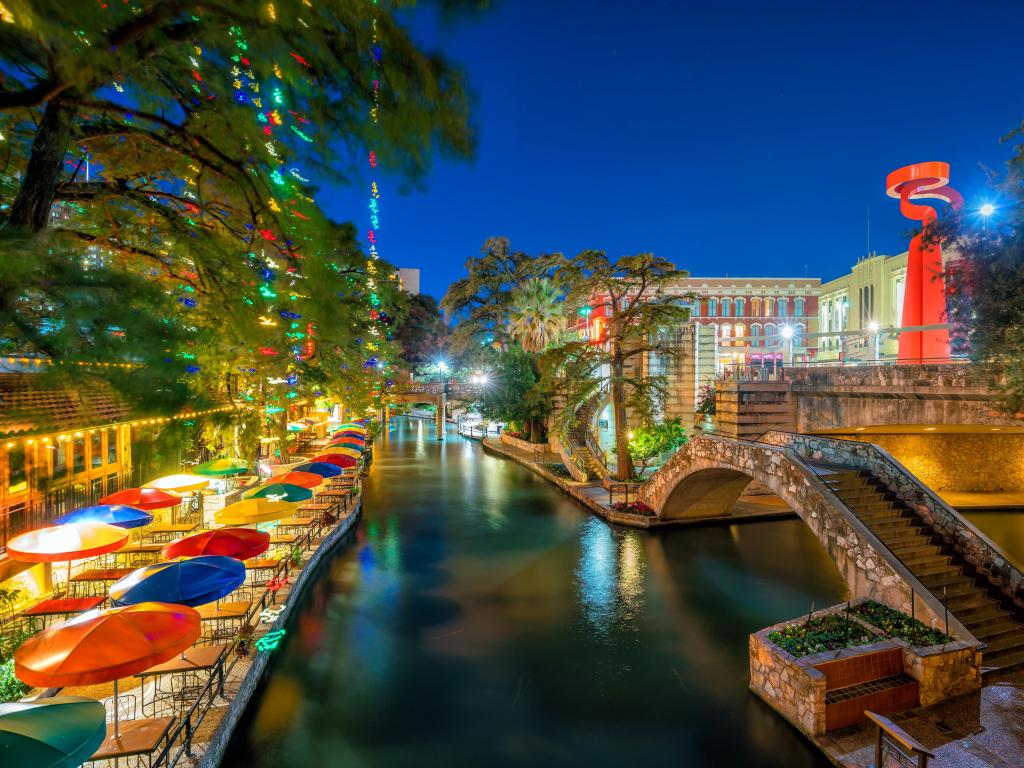 Bright colored umbrellas beside the river along the Riverwalk in San Antonio