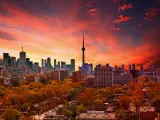 Sunset over Toronto Skyline with red and orange hues and the CN Tower in the center