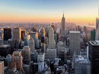 Amazing panorama view of New York city skyline and skyscraper at sunset. 