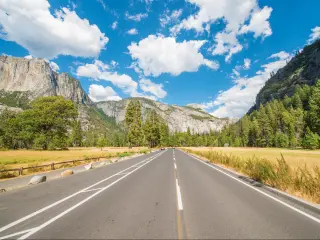 Highway through the mountains of Yosemite National Park on the road trip from San Francisco to Las Vegas