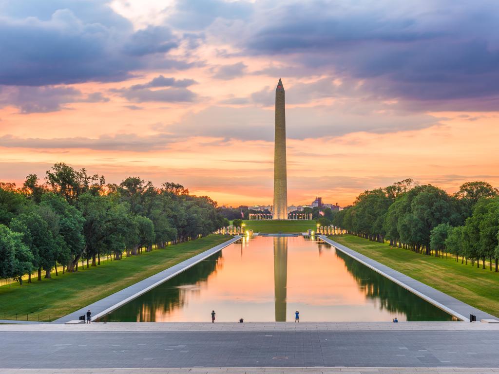 Washington Monument on the Reflecting Pool in Washington, DC, USA at dawn.