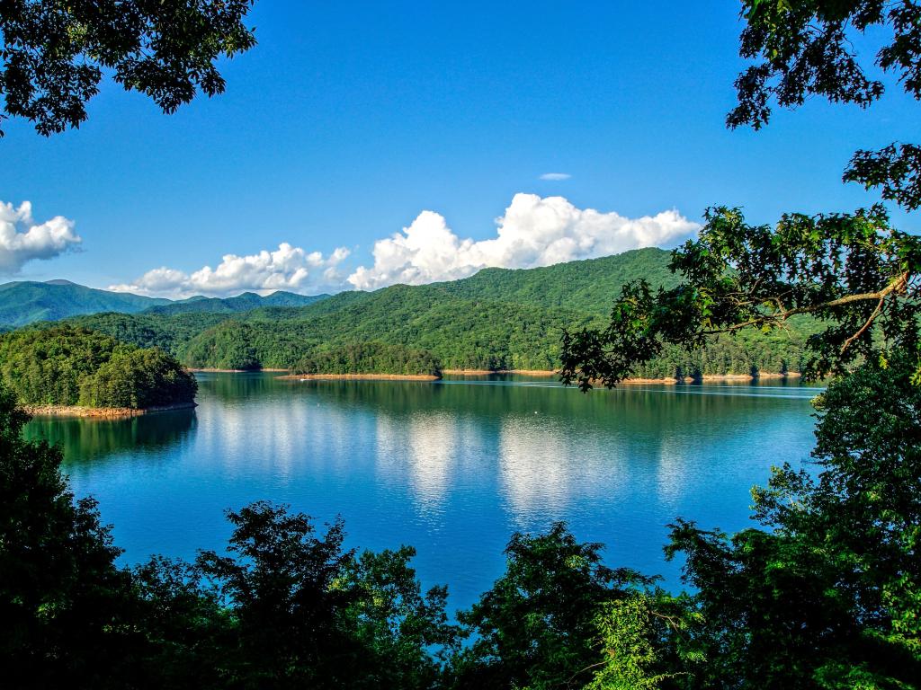Fontana Lake seen through the trees, under a blue sky, close to the Appalachian Trail  