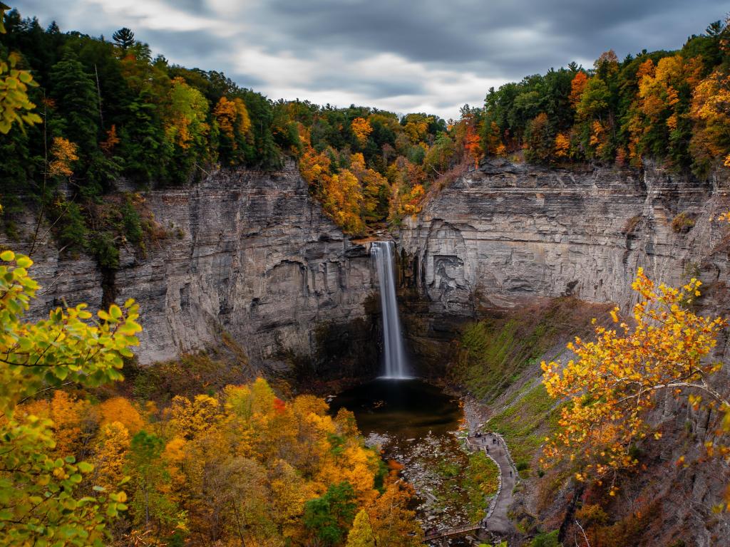 Ithaca, New York with a scenic, autumn view of Taughannock Falls (waterfall) at Taughannock Falls State Park.