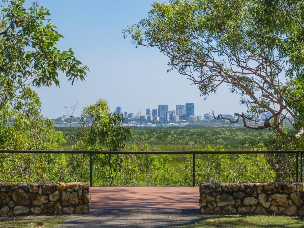 View of Darwin Skyline in the distance, through the trees in Charles Darwin National Park