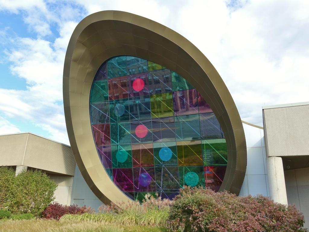 One of the colorful main windows of the Strong National Museum of Play on an overcast day