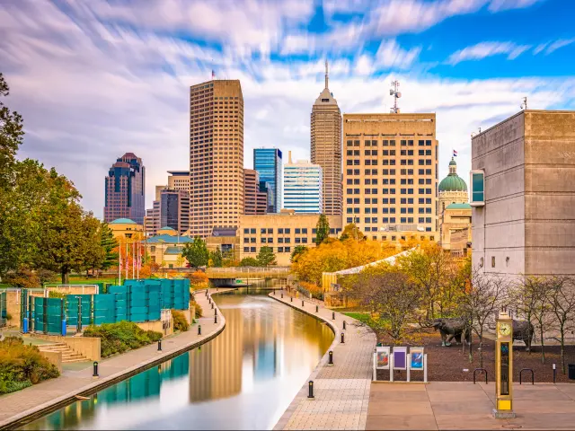 Indianapolis, Indiana, USA downtown skyline over the river walk.