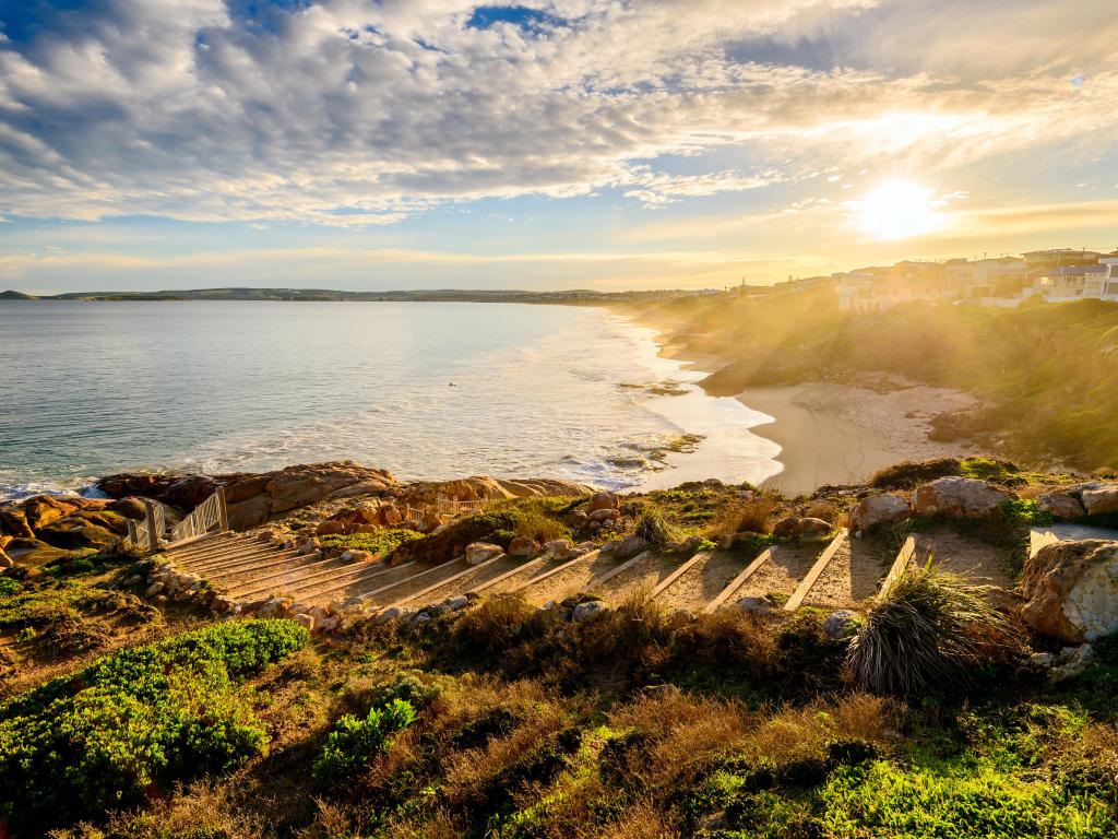 Port Elliot, Horseshoe Bay, South Australia taken at sunset with stone steps in the foreground and the bay in the background.