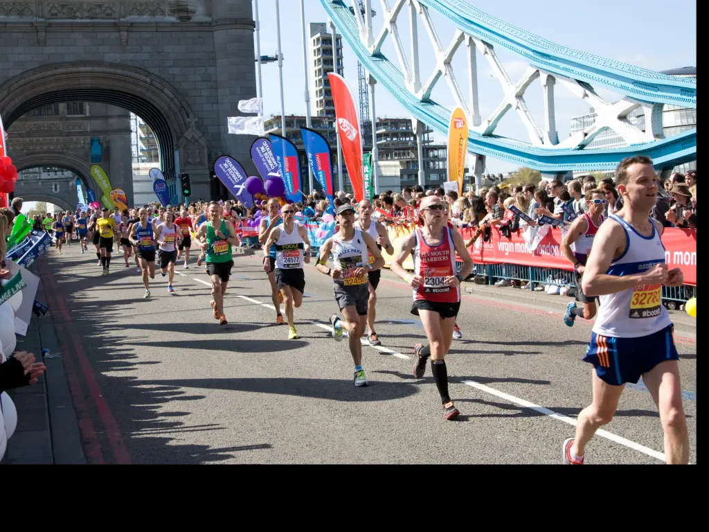 London Marathon runners passing over the Tower Bridge