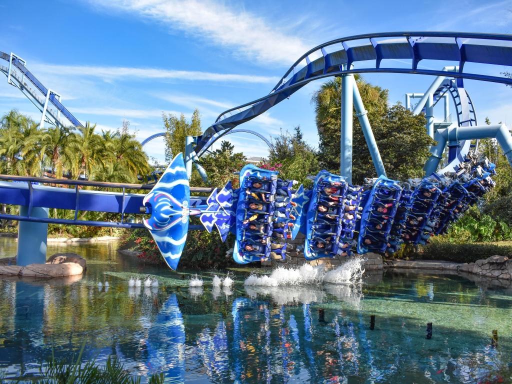 People riding the Manta Ray Rollercoaster at Seaworld, Orlando on a sunny day. 