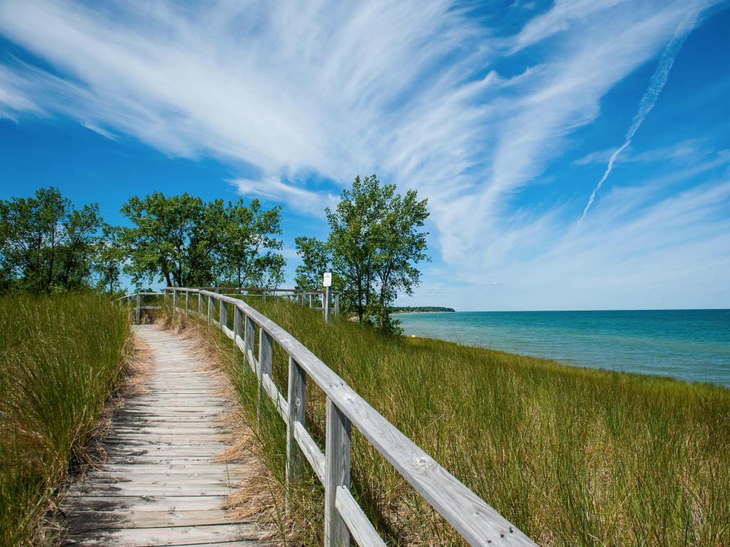 Saginaw, Michigan, USA with a view of Port Austin and the beach and the lake where Saginaw Bay and Lake Huron meet at Port Crescent State Park.